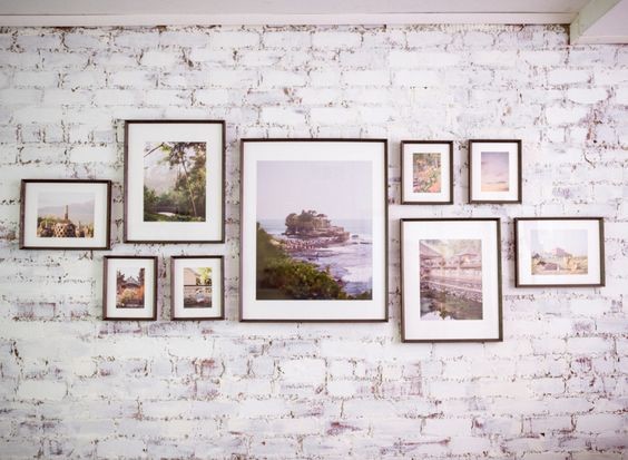 Custom framed photos and artwork make up this gallery wall
