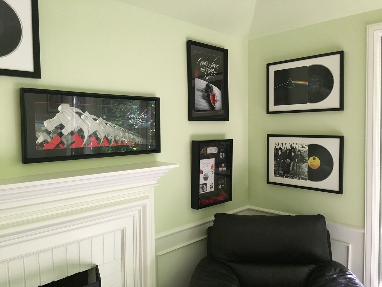 Accent wall with framed art and vinyl records